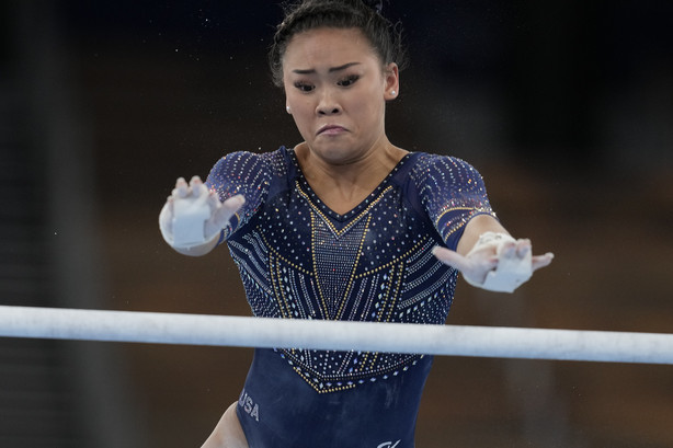 Sunisa Lee of the United States, performs on the uneven bars during the artistic gymnastics women's apparatus final at the 2020 Summer Olympics, Sunday in Tokyo, Japan.