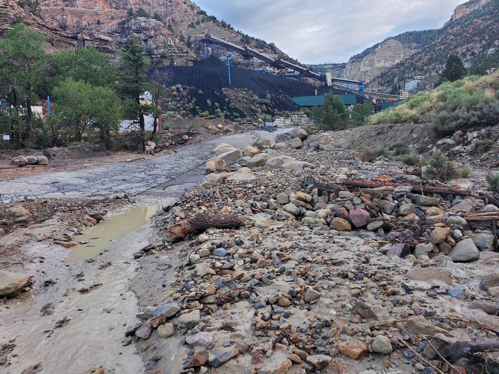 Emery County crews clean up after a flash flooding event near the Gentry Mountain Mine that killed one man on Sunday.