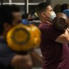 US hits 70% vaccination rate — a month late, amid a surge