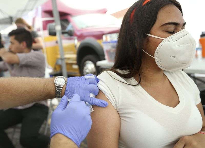 Daniela Villanueva gets a free COVID-19 vaccination at
the Salt Lake County Health Department’s mobile health center at
Rancho Market in West Valley City on Friday.