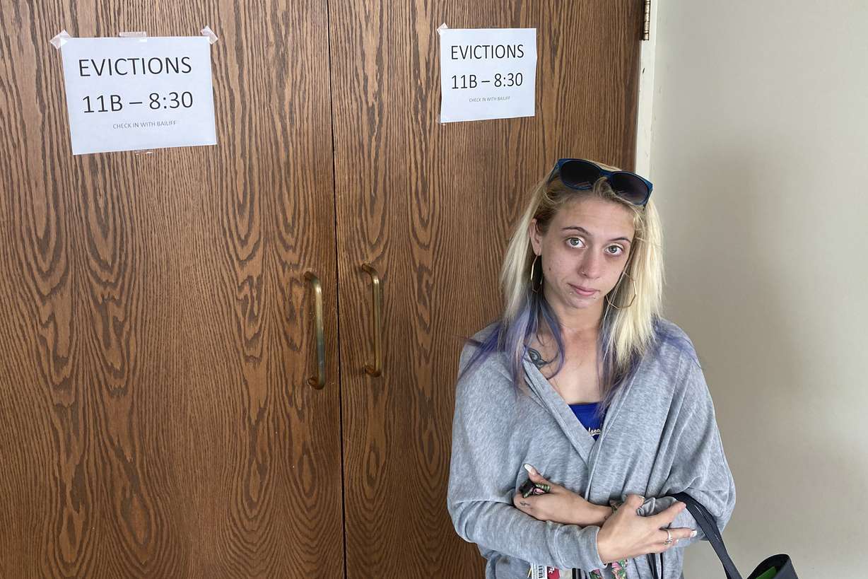 Chelsea Rivera, 27, stands outside Franklin County evictions court in Columbus, Ohio on Monday, August 2, 2021 as she awaits a hearing on an eviction notice filed against her last month.
