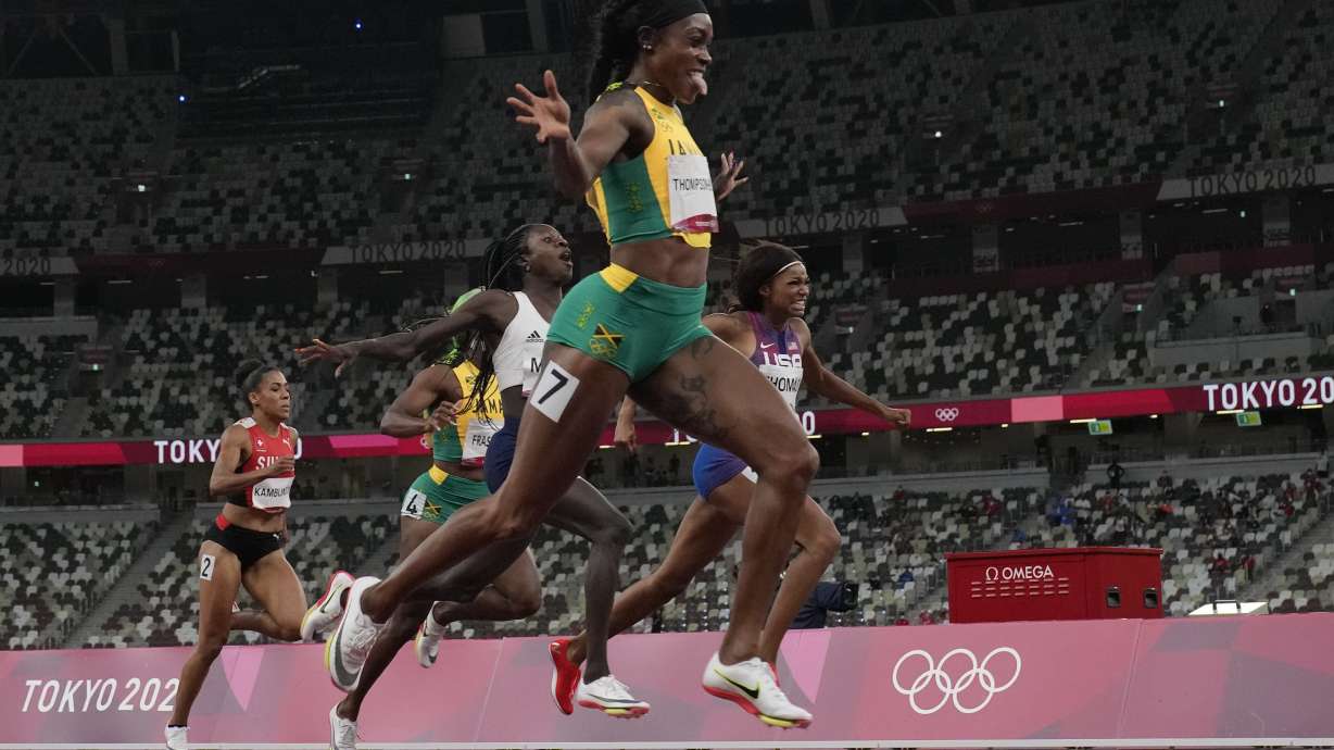 Elaine Thompson-Herah, of Jamaica, wins the final of the women's 200-meters at the 2020 Summer Olympics, Tuesday, Aug. 3, 2021, in Tokyo.