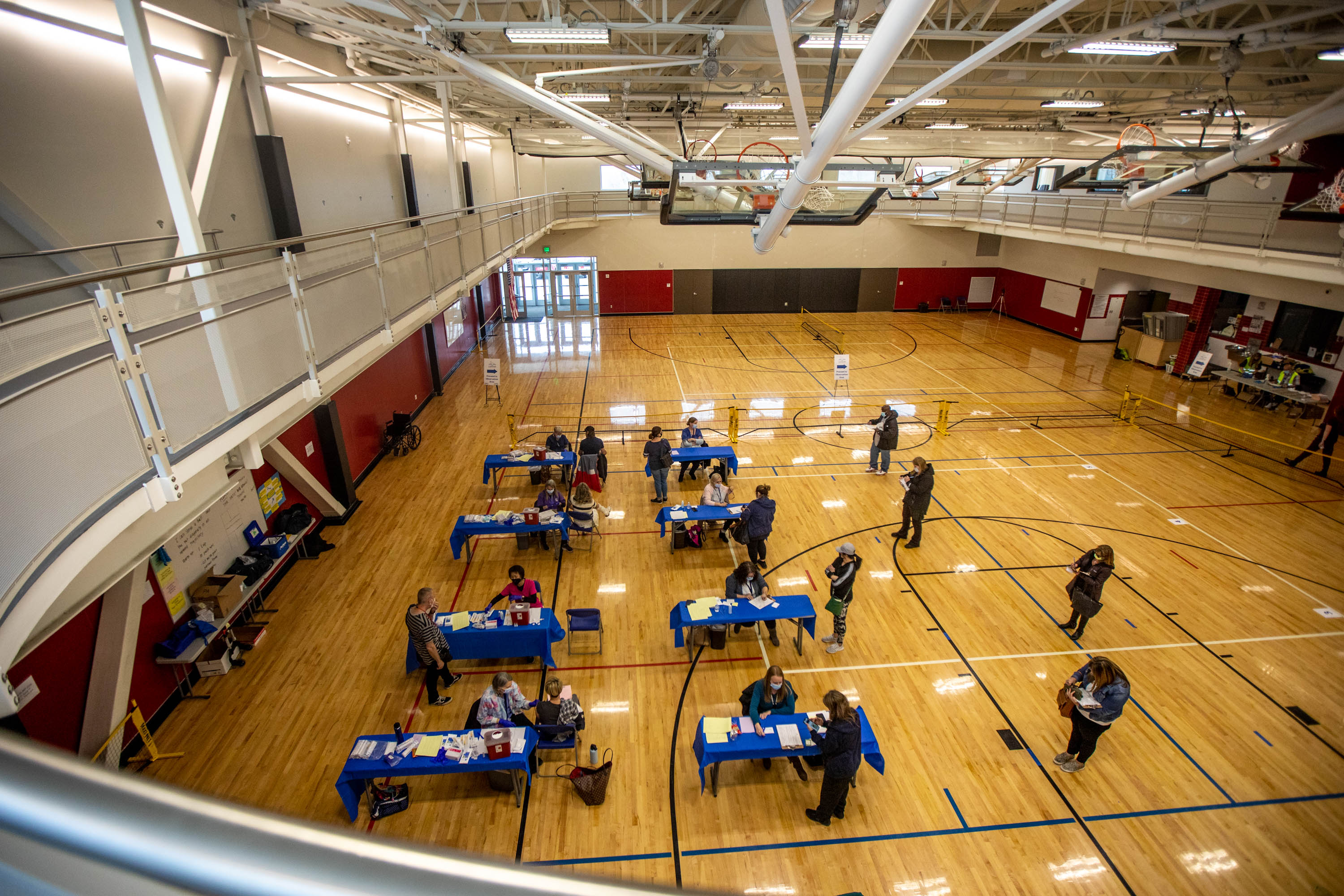 People receive vaccines at the Canyons School District final COVID-19 Vaccination Clinic at Mount Jordan Middle School in Sandy on Thursday, March 11, 2021. More Utah school districts are offering vaccine clinics this fall.