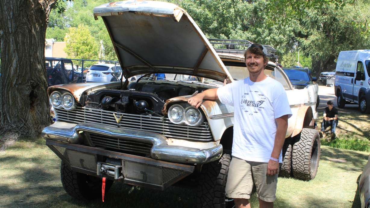 Tyler Merrill shows off his 1958 Plymouth Savoy at the Cache Valley Cruise-In July 3, 2021. Cache County resident Tyler Merrill calls the rebuild of his 1958 Plymouth "Maxine," a mix of the "Mad Max" and "Christine" movie titles; the films each featured a 1958 Plymouth Fury.
