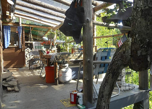 This undated photo provided by Jodie Gedeon shows the shack that David Lidstone, 81, has built and lived in for nearly three decades in the woods of Canterbury, N.H., growing his own food and cutting his firewood. He's now jailed after not complying with a court order to leave, and there's a growing petition to just let "River Dave" live out his days off the grid.