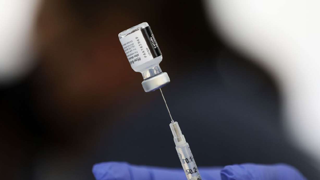 People take advantage of free COVID-19 vaccinations at the Salt Lake County Health Department’s mobile health center at Rancho Market in West Valley City on Friday.