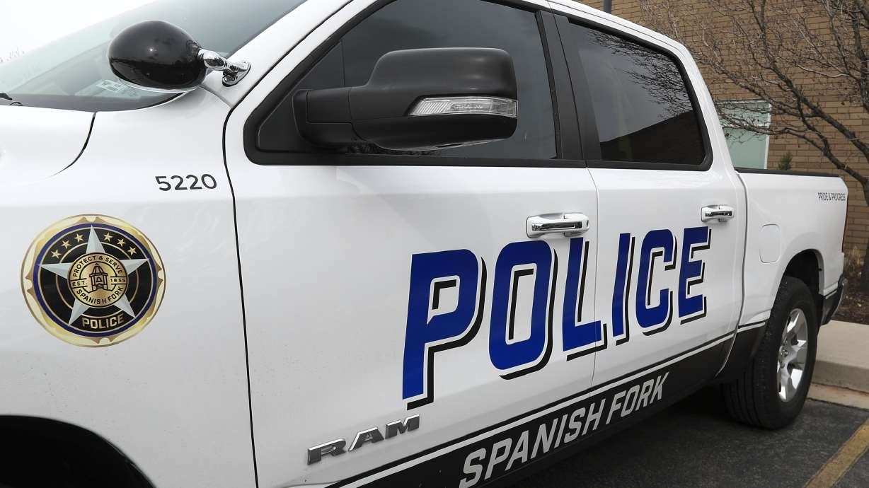 A Springville woman was arrested for investigation of DUI Sunday after police say her car hit a Spanish Fork police officer's vehicle, then pinned a pedestrian against a tree.