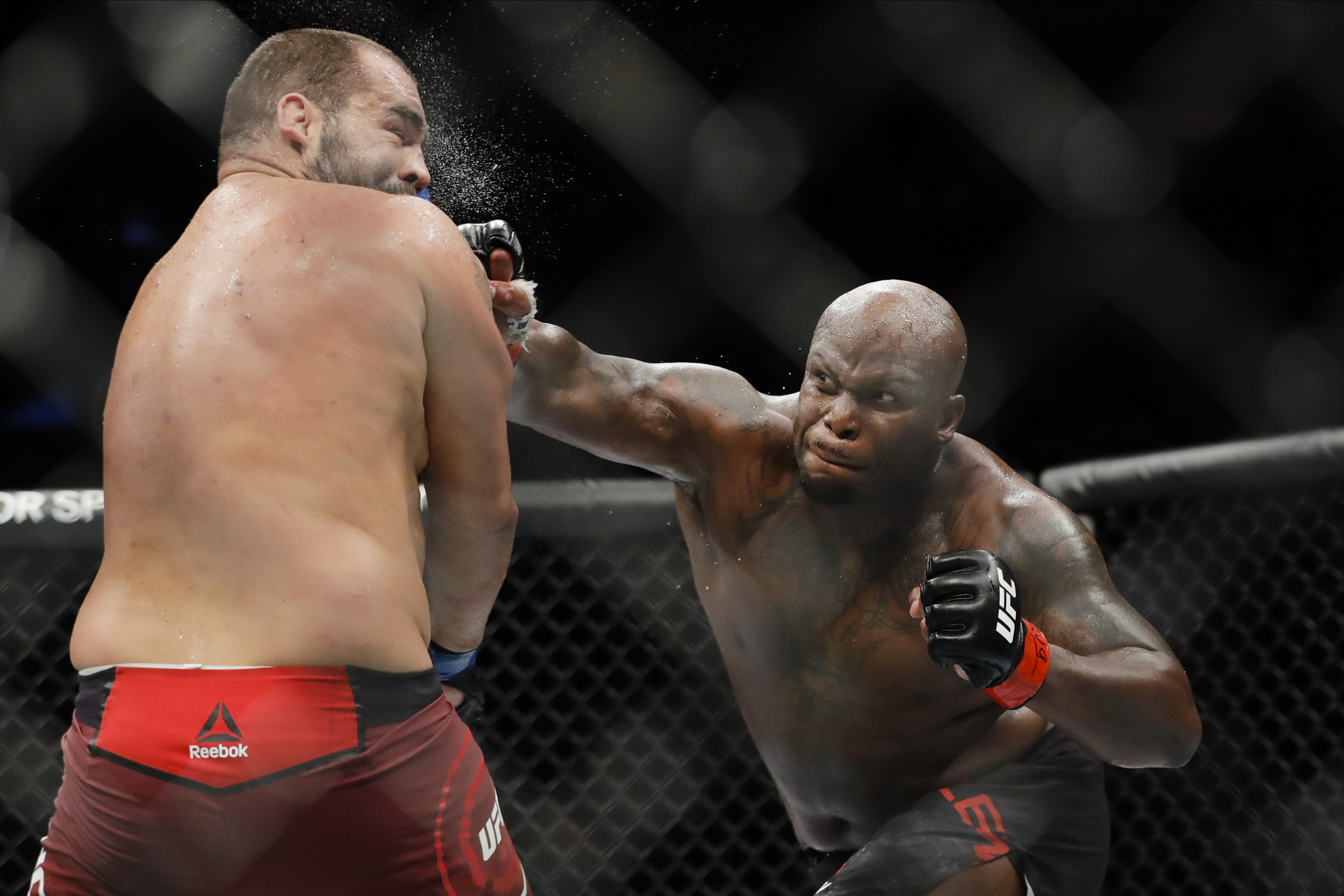 In this Nov. 2, 2019, file photo, Derrick Lewis, right, punches Bulgaria's Blagoy Ivanov during the second round of a heavyweight mixed martial arts bout at UFC 244 in New York. Lewis won the fight.