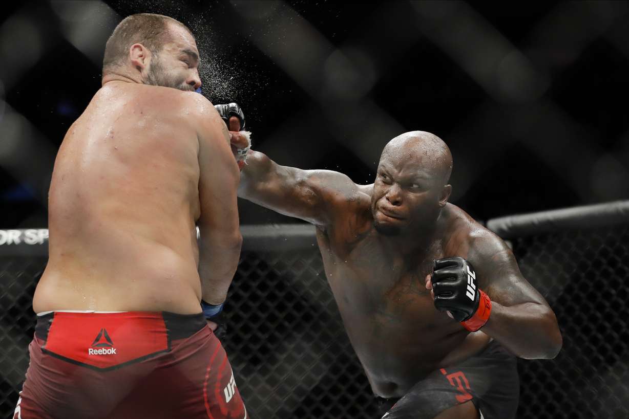 In this Nov. 2, 2019, file photo, Derrick Lewis, right, punches Bulgaria's Blagoy Ivanov during the second round of a heavyweight mixed martial arts bout at UFC 244 in New York. Lewis won the fight.