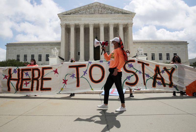 DACA recipients and their supporters celebrate outside the U.S. Supreme Court after the court ruled in a 5-4 vote that President Donald Trump's 2017 move to rescind the Deferred Action for Childhood Arrivals program, created in 2012 by his Democratic predecessor Barack Obama, was unlawful, in Washington, D.C., June 18, 2020.