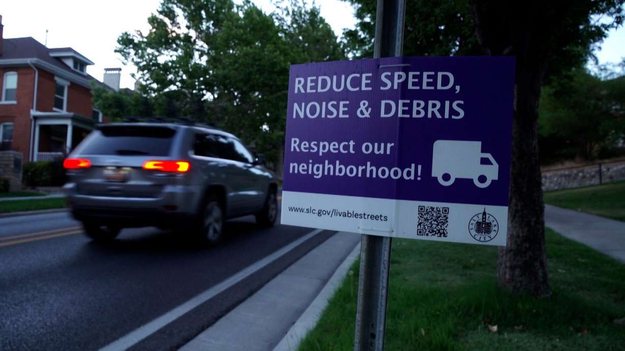 A sign in Salt Lake City reminds people to respect the neighborhood. Vehicles constantly cruise State Street, sometimes until the early morning hours, residents say.