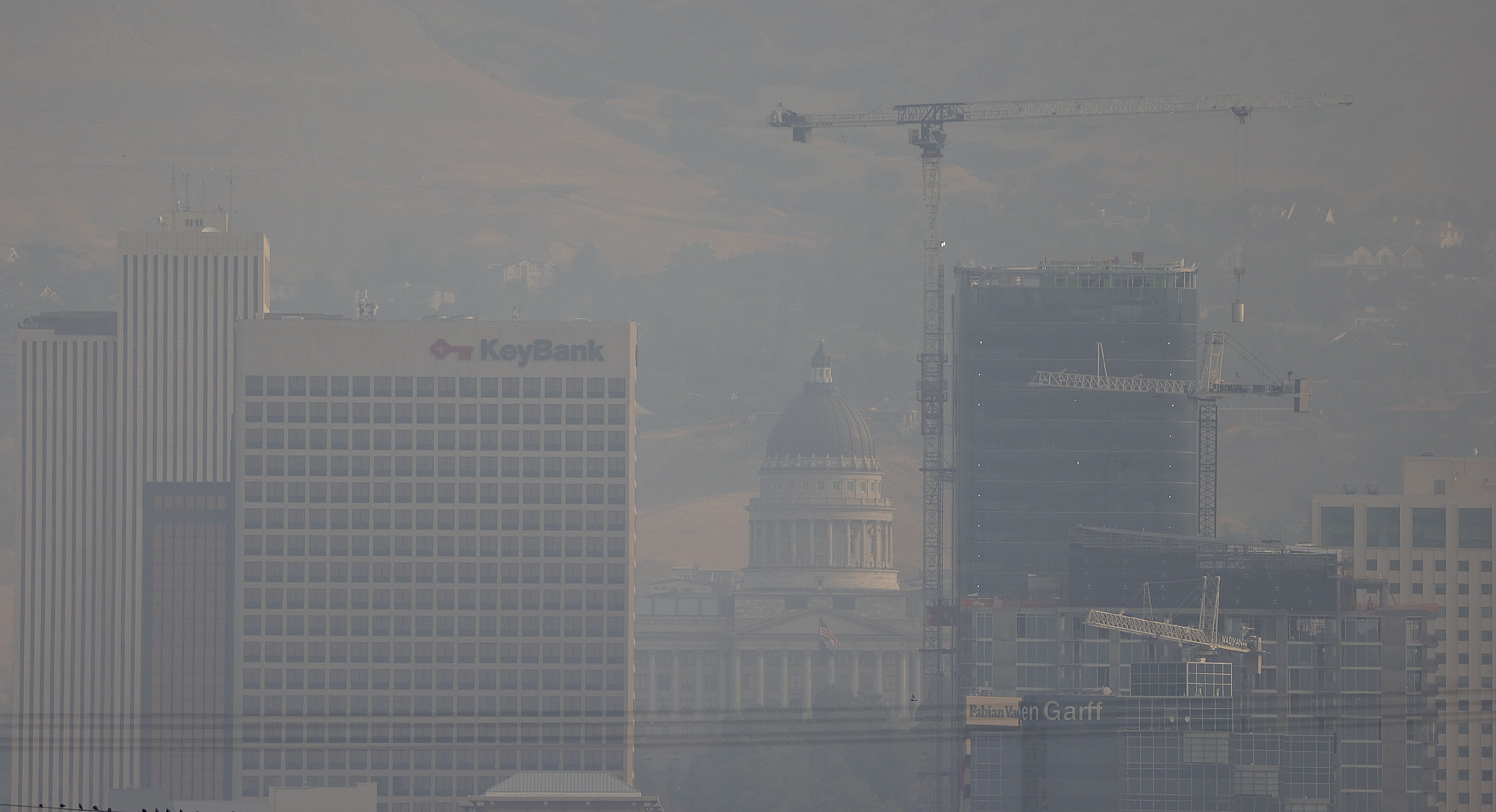 Smoky air obscures the skyline in Salt Lake City on Aug 6. Wildfire smoke and unhealthy ozone pollution will
contribute to bad air quality in Utah. A new Utah study aims to look better into how poor air quality indoors relates to air quality levels outdoors.