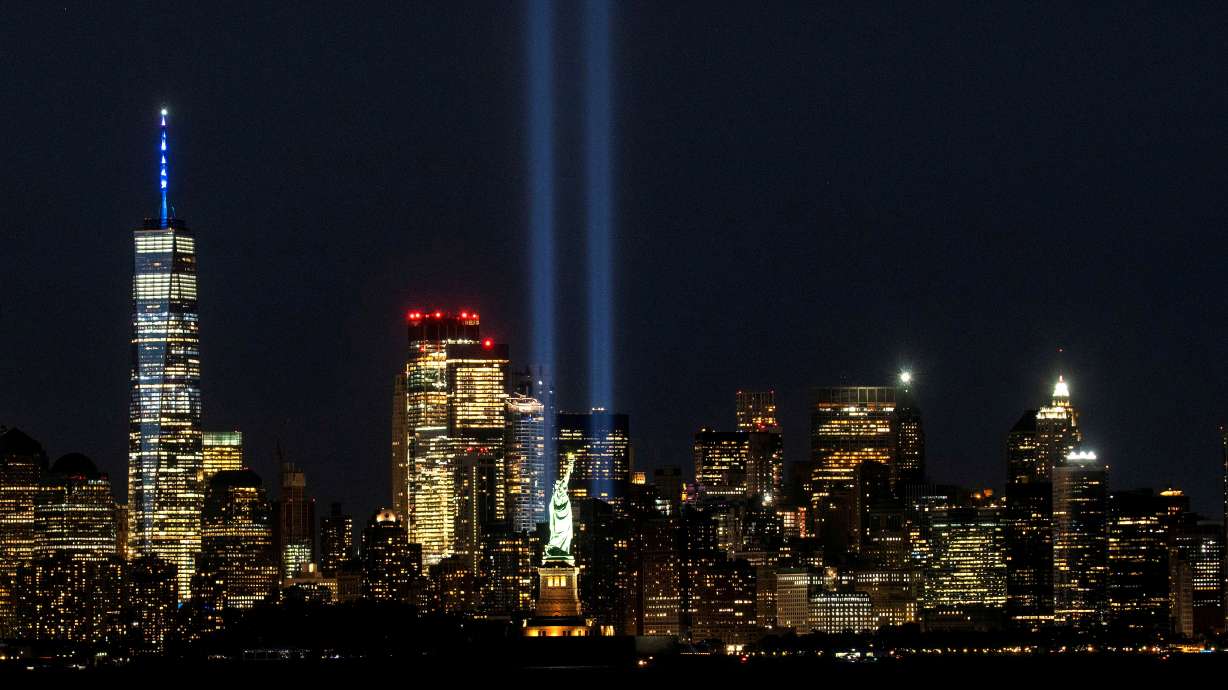 The Statue of Liberty and One World Trade Center are seen as the Tribute in Light shines in downtown Manhattan to commemorate the 19th anniversary of the September 11, 2001 attacks on the World Trade Center. In a letter released Friday, family members of victims of the Sept. 11 attacks are opposing President Joe Biden’s participation in memorial events unless he declassifies government documents that they contend will show Saudi Arabian leaders supported the attacks.