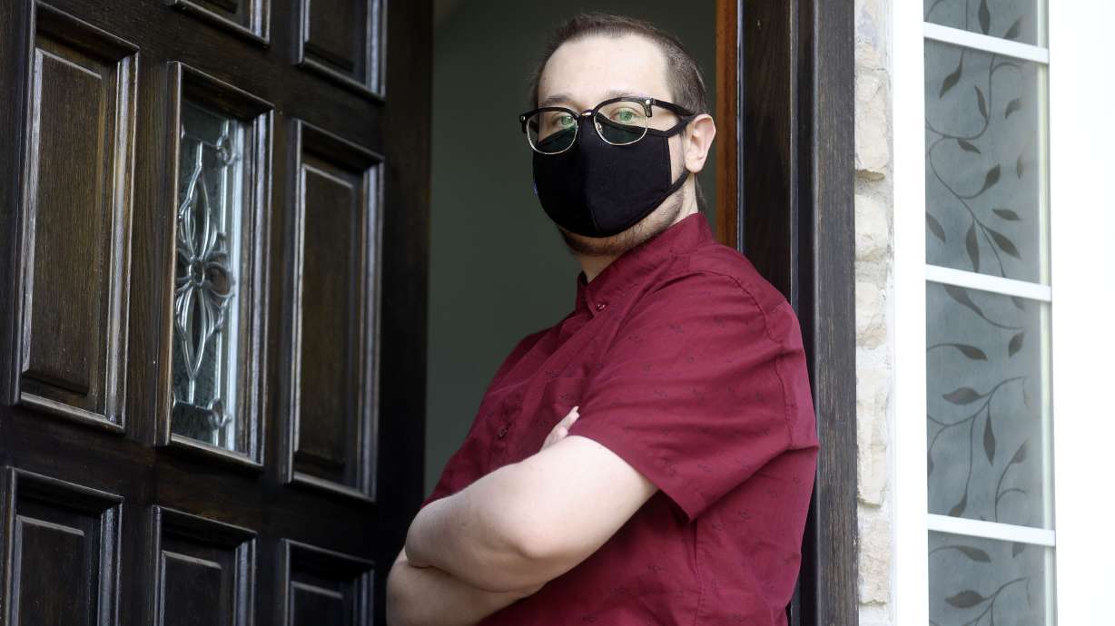 Ethan Overbaugh, who is immunocompromised, poses for a photo outside of his home in Layton on Thursday. Overbaugh has been quarantined for a year and a half as he's undergone leukemia treatments, and he can't get the COVID-19 vaccine until he is off anti-rejection medication for a bone marrow transplant.'