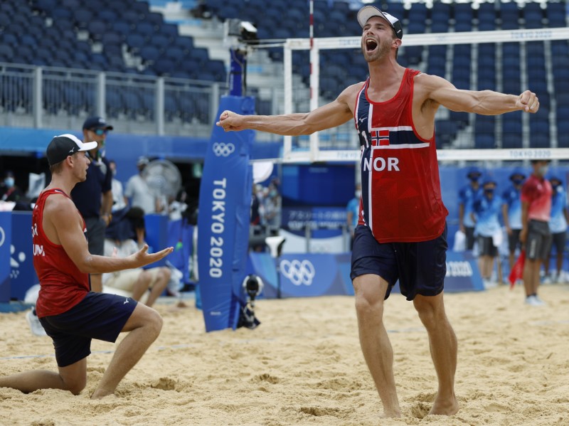 Anders Mol of Norway and Christian Sorum of Norway react after winning gold medal match against the Russian Olympic Committee.