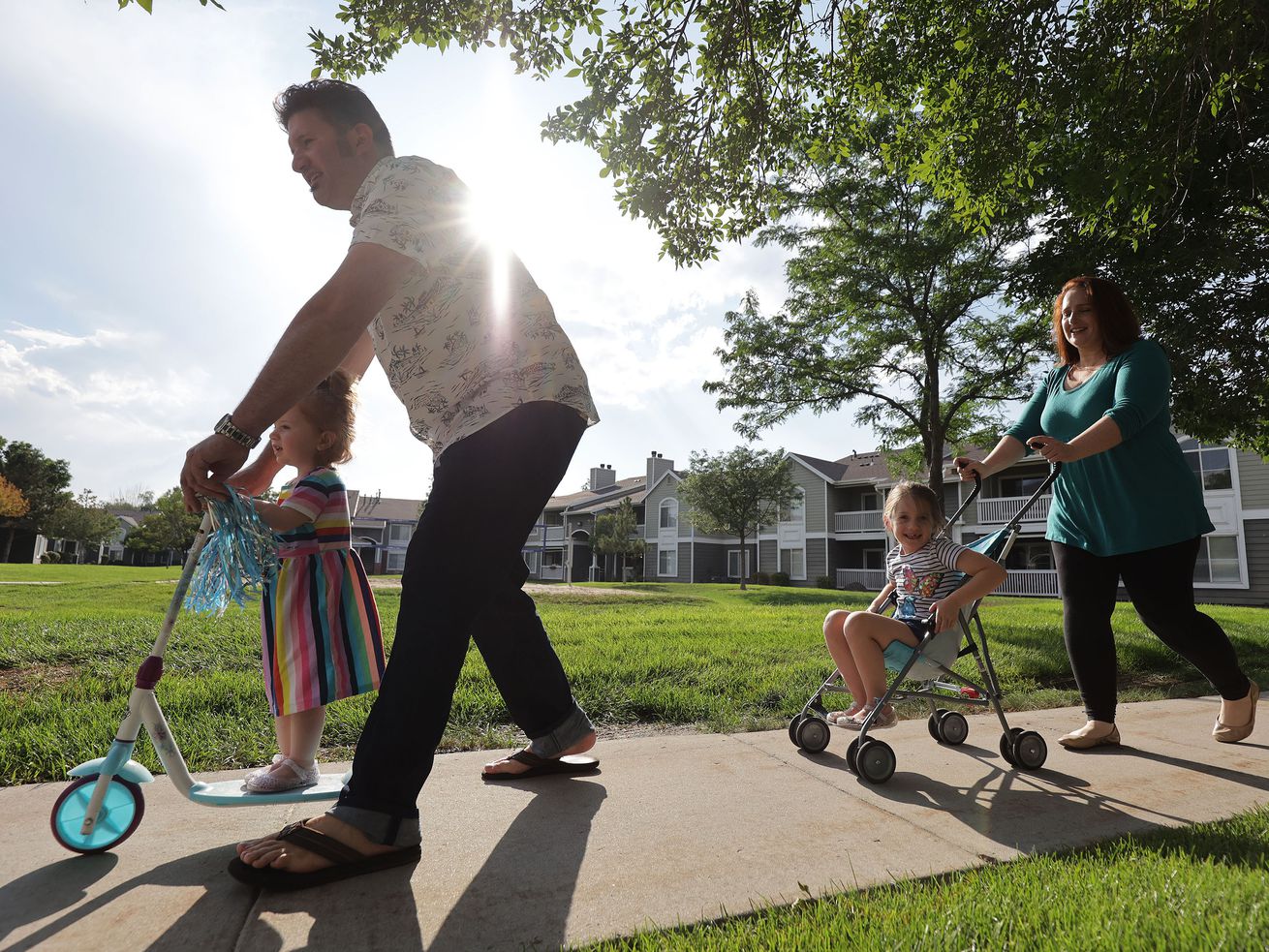 Andrew and Ashley Munk walk with their children Mara, 5, and Ellie, 2, near their home in Draper on Thursday. Ashley Munk spoke during the "Families First: What the Build Back Better Agenda Means for People of Faith” virtual meeting that the White House held on Aug. 4 to tout President Joe Biden’s Build Back Better agenda.