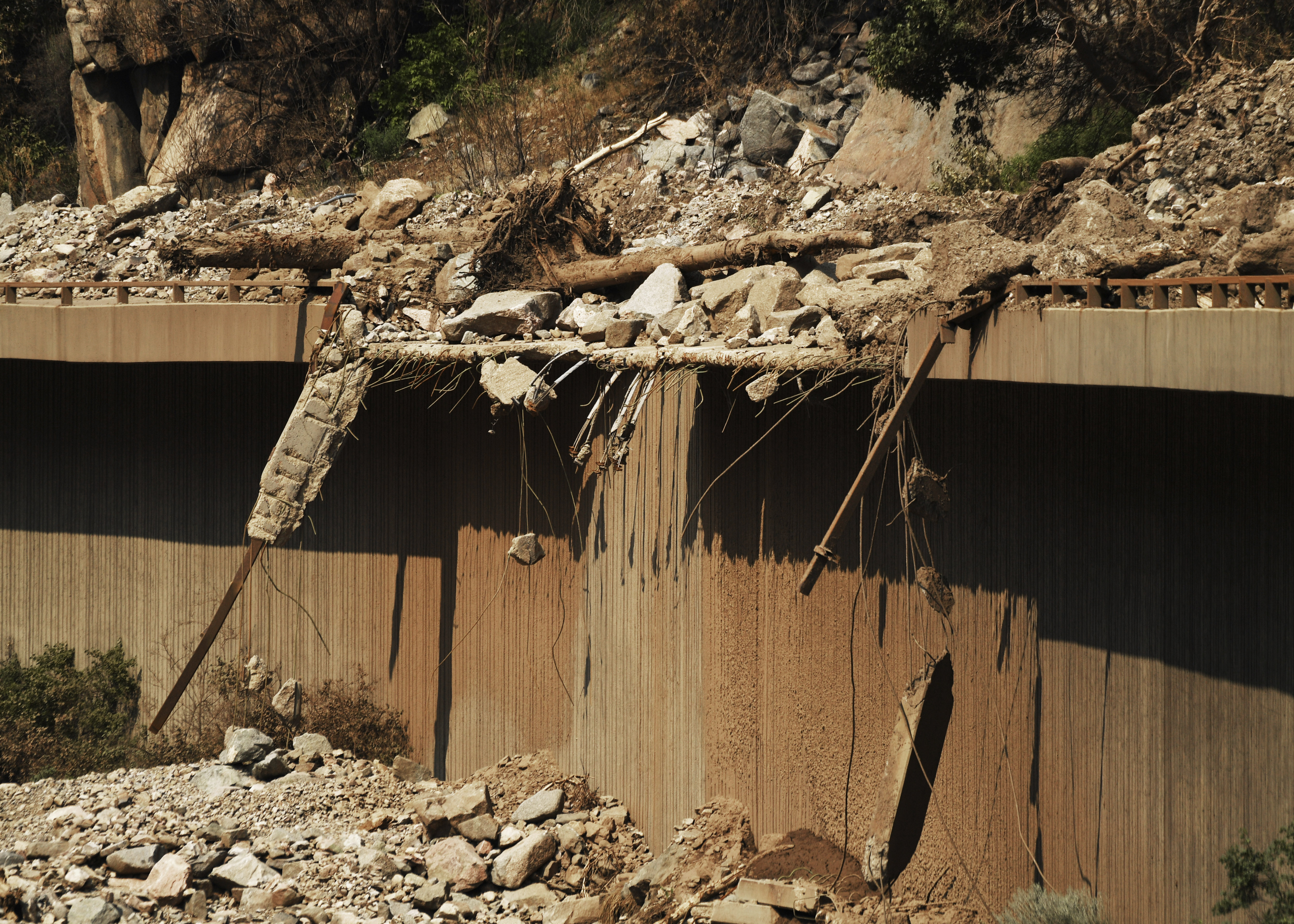 Recent mudslides have I-70 in Glenwood Canyon closed, Thursday, in Glenwood, Colo. As ominous storm clouds gathered in western Colorado over a large area blackened by a recent wildfire, torrential rain fell and the charred land stripped of vegetation gave way, sending a rush of mud and boulders tumbling down steep canyon walls and onto Interstate 70.