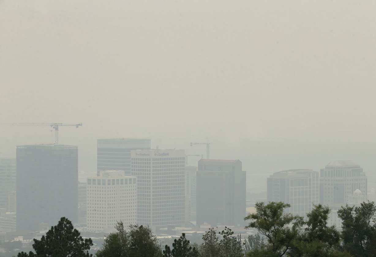 The view of Salt Lake City is obscured by smoke from the California and Oregon wildfires on Friday, Aug. 6, 2021. Wildfires from the West have produced huge columns of smoke that have drifted as far east as New York, creating some of the worst air quality that state has seen in 15 years.