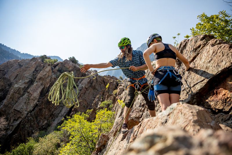 Kevin Learned, a ski and rock climbing guide for Utah
Mountain Adventures, sets up a rappel with his client, Julia
Redden, 15, at the top of a climb in the Storm Mountain area of Big
Cottonwood Canyon on Saturday, July 24, 2021.