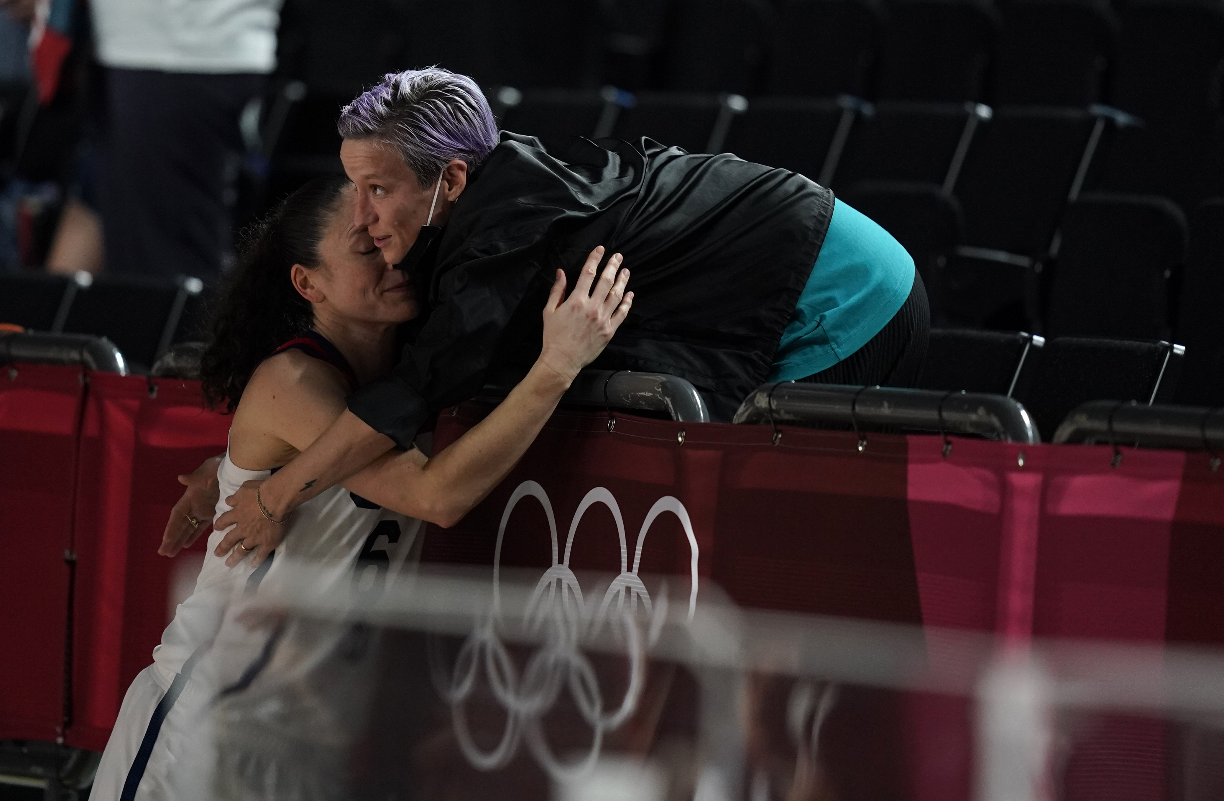 United States's Sue Bird (6), left, hugs her fiance Megan Rapinoe after United States won the women's basketball gold medal game against Japan at the 2020 Summer Olympics, Sunday, Aug. 8, 2021, in Saitama, Japan.
