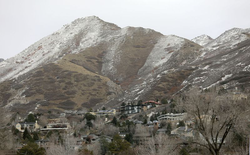 Snow dusts the foothills above Salt Lake City on
Tuesday, Feb. 9, 2021.