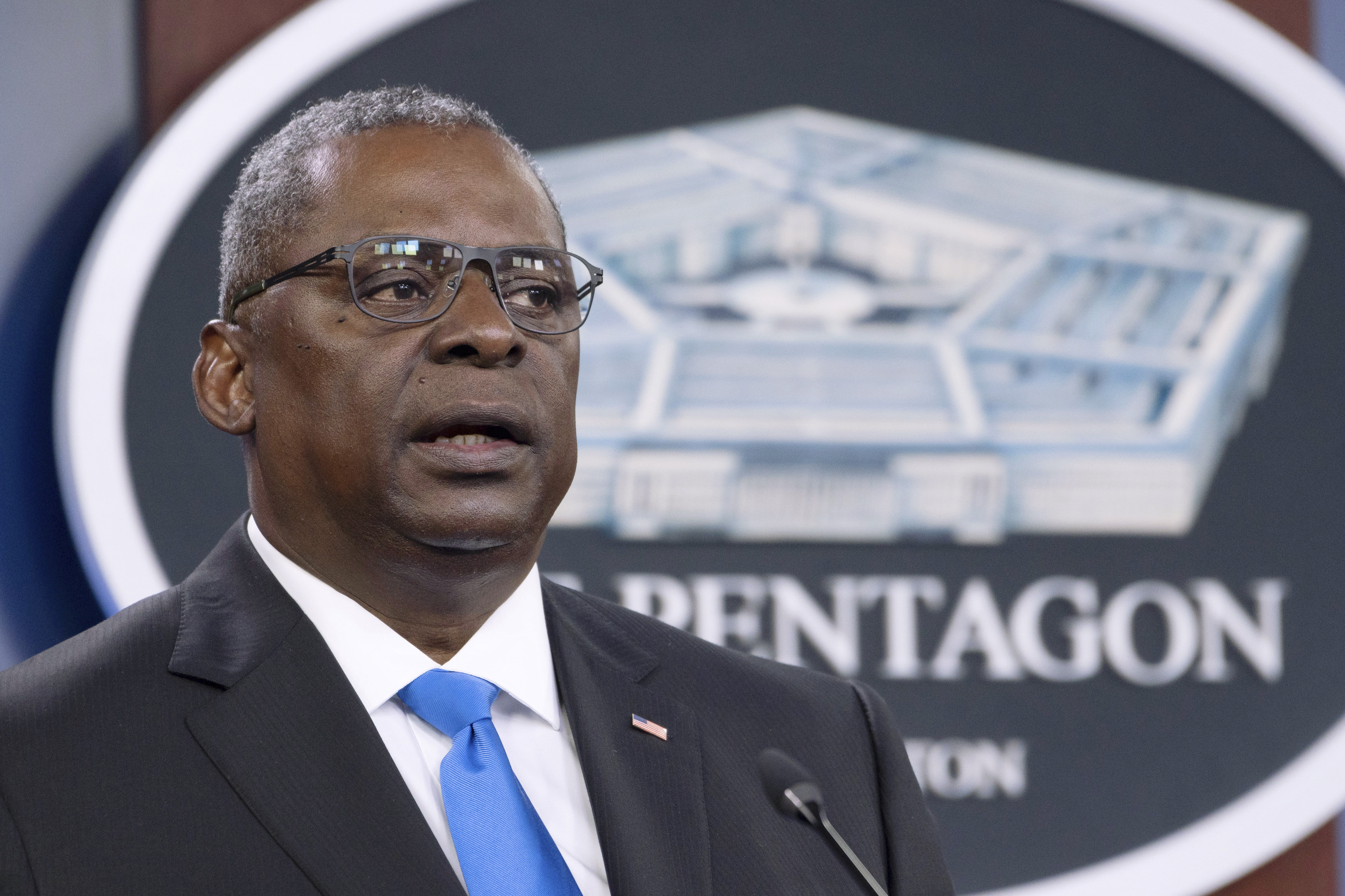 Defense Secretary Lloyd Austin speaks at a press briefing at the Pentagon July 21, 2021. Members of the U.S. military would be required to have the COVID-19 vaccine beginning Sept. 15, under a plan announced Monday