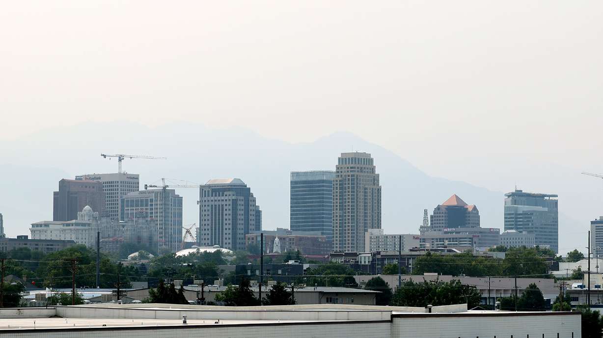 Smoke in the Salt Lake City area on Monday. Meteorologists say the unhealthy smoke is expected to linger in Utah the next few days before a southerly pattern arrives Wednesday or Thursday and helps to clear it out.