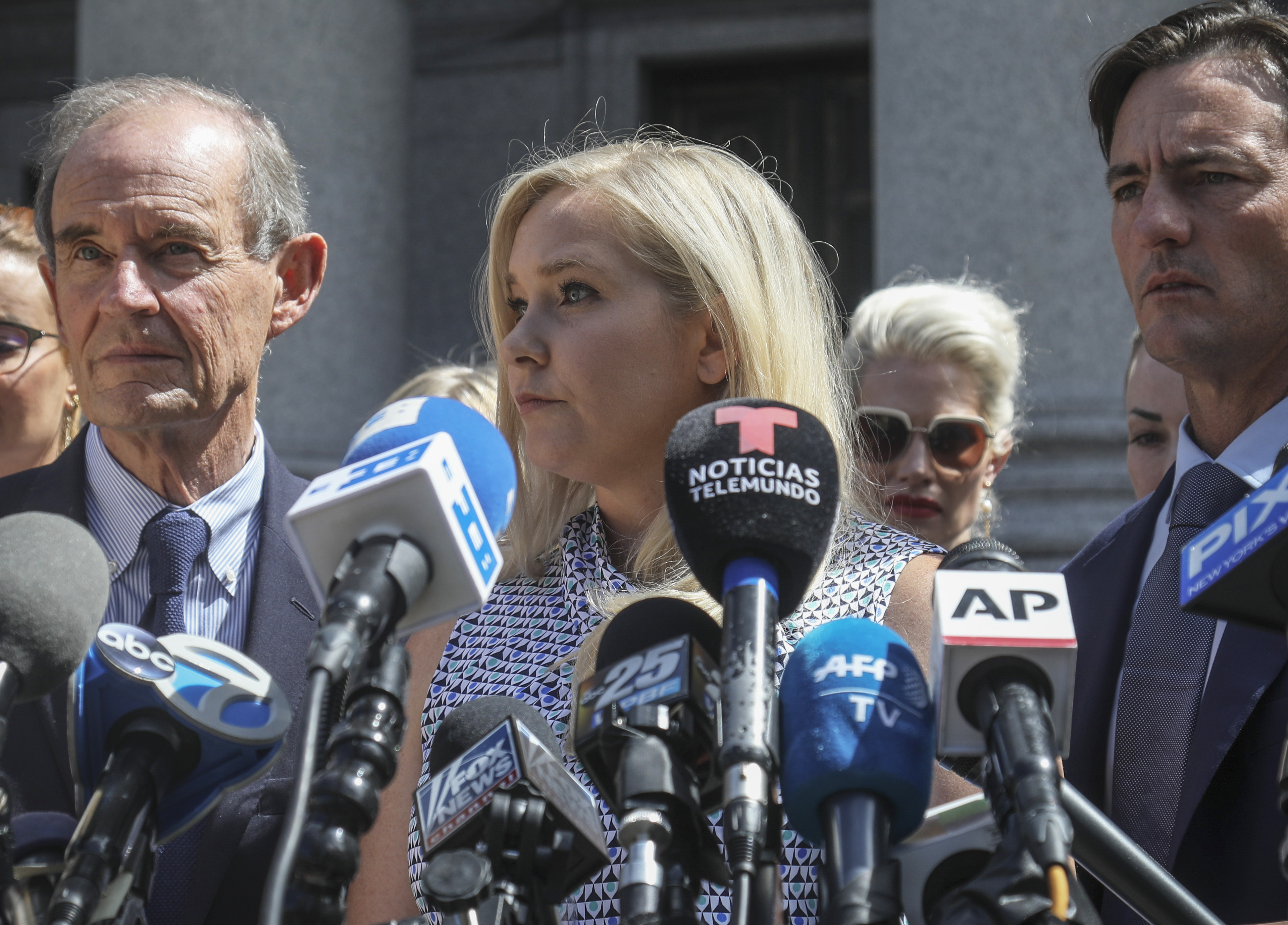 Virginia Giuffre, center, who says she was trafficked by sex offender Jeffrey Epstein, holds a news conference outside a Manhattan court in New York on Aug. 27, 2019. On Monday, Giuffre sued Prince Andrew saying he sexually assaulted her when she was 17.