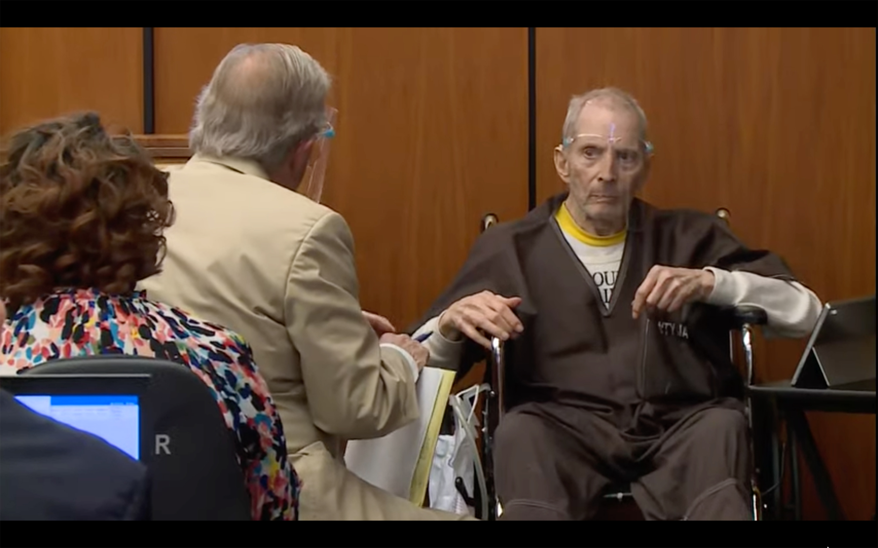 In this still image taken from the Law & Crime Network court video, real estate heir Robert Durst, right, describes what ailments he has to defense attorney Dick Deguerin during his murder trial on Monday in Los Angeles County Superior Court in Inglewood, Calif. 