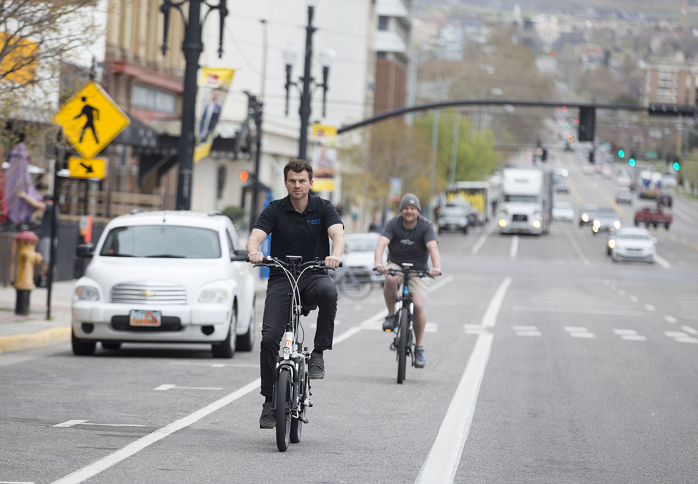 Spencer Moyers and Cory Martin ride electric bicycles in Salt Lake City in April 2017. American Association of State Highway and Transportation Officials recently approved a measure to designate five new routes in Utah where cyclists can ride their bikes long distances using routes that are bike-friendly.