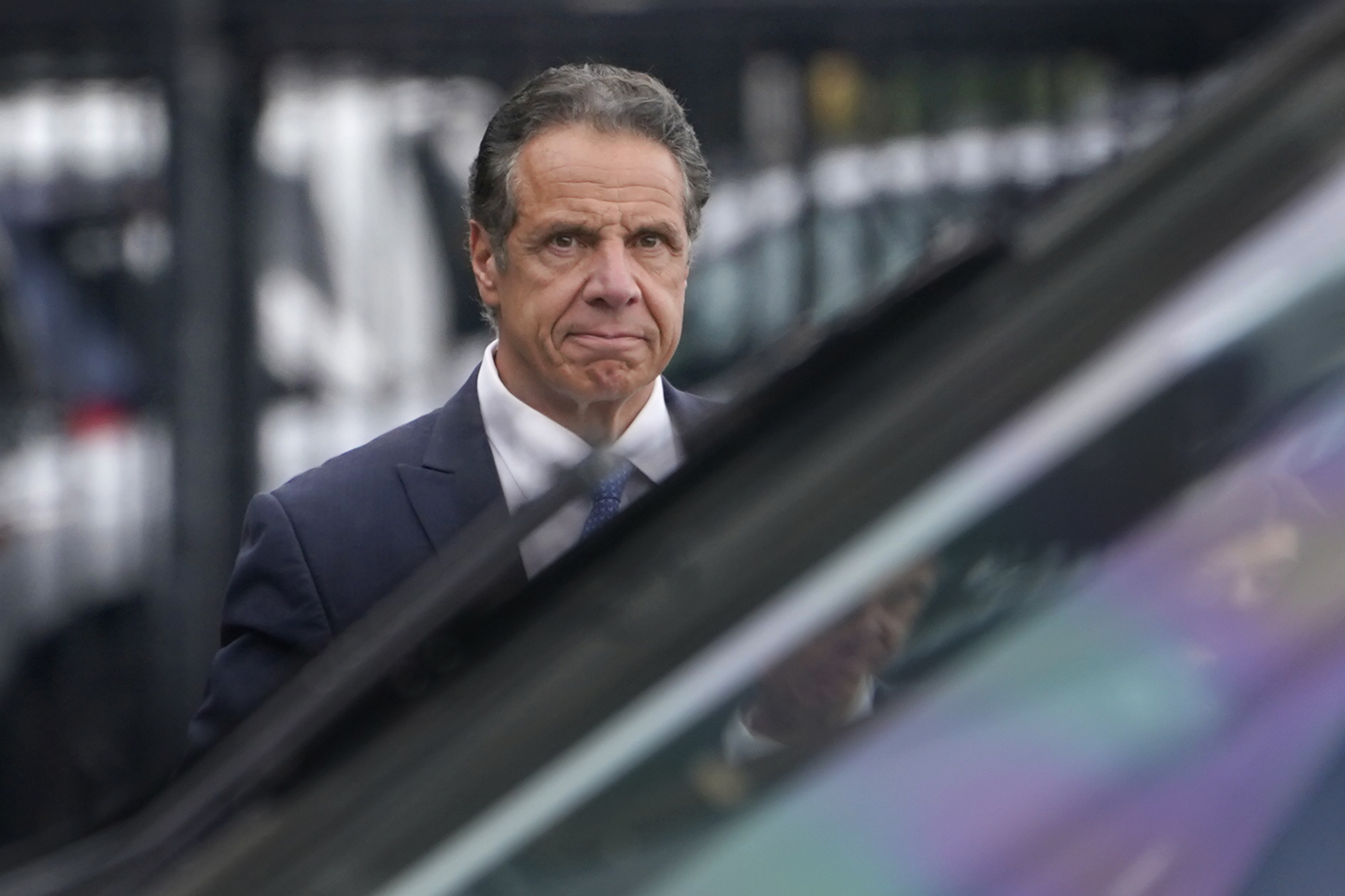 New York Gov. Andrew Cuomo prepares to board a helicopter after announcing his resignation Tuesday in New York. Cuomo says he will resign over a barrage of sexual harassment allegations.