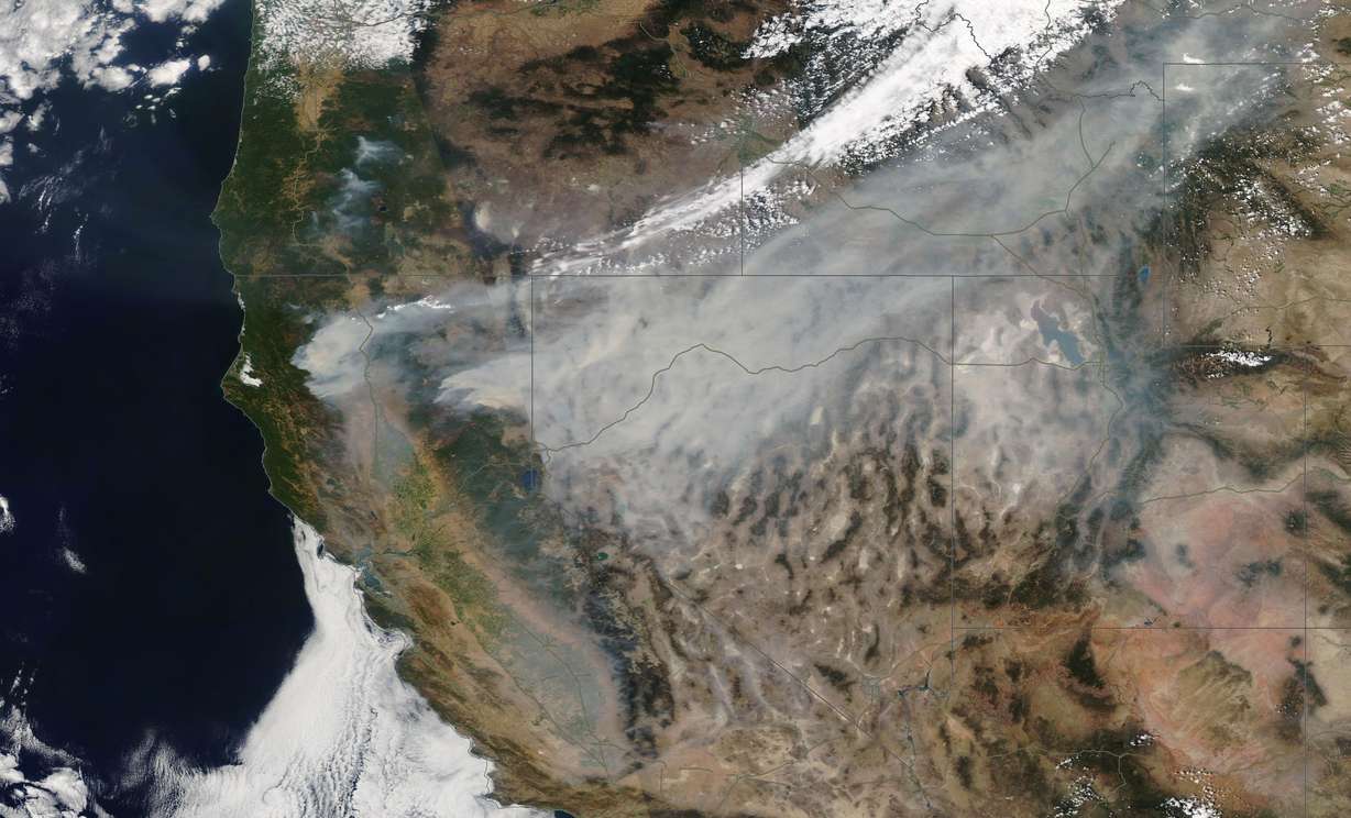 A satellite image shows the extent of the Dixie Fire burns in Northern California on Sunday, Aug. 8, 2021