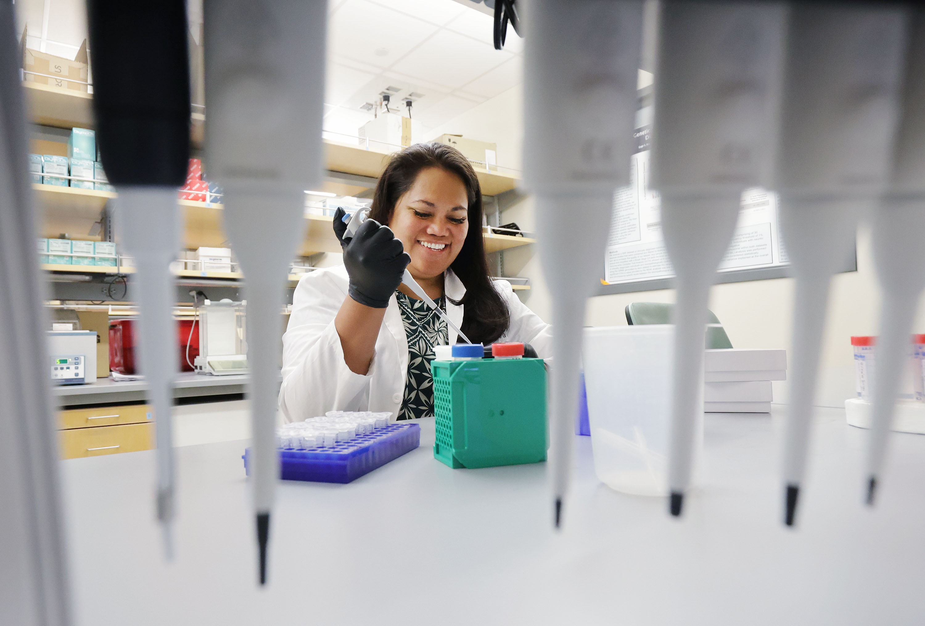 Graduate student Justina Tavana extracts DNA from a saliva sample in a lab at BYU in Provo on Tuesday. BYU researchers are investigating elevated rates of Alzheimer's disease in Pacific Islander and Native American communities.