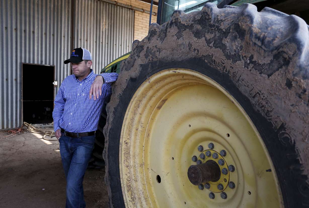 Will Thelander, a partner in his family’s farming business, talks about expected water shortages in Arizona that will impact his operation in Casa Grande, Ariz., Thursday, July 22, 2021. The Colorado River has been a go-to source of water for cities, tribes and farmers in the U.S. West for decades. But climate change, drought and increased demand are taking a toll. The U.S. Bureau of Reclamation is expected to declare the first-ever mandatory cuts from the river for 2022.