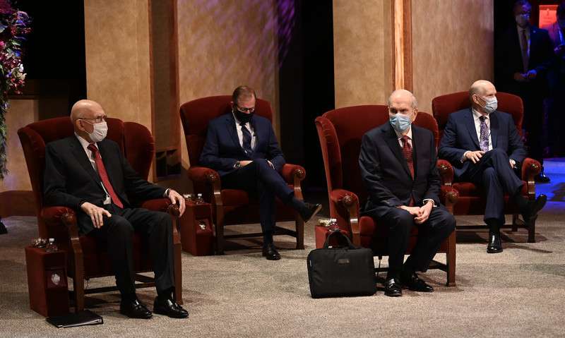 Members of the First Presidency and Quorum of the Twelve Apostles wear face masks and physical distance before the start of a general conference of The Church of Jesus Christ of Latter-day Saints on Oct. 3, 2020.