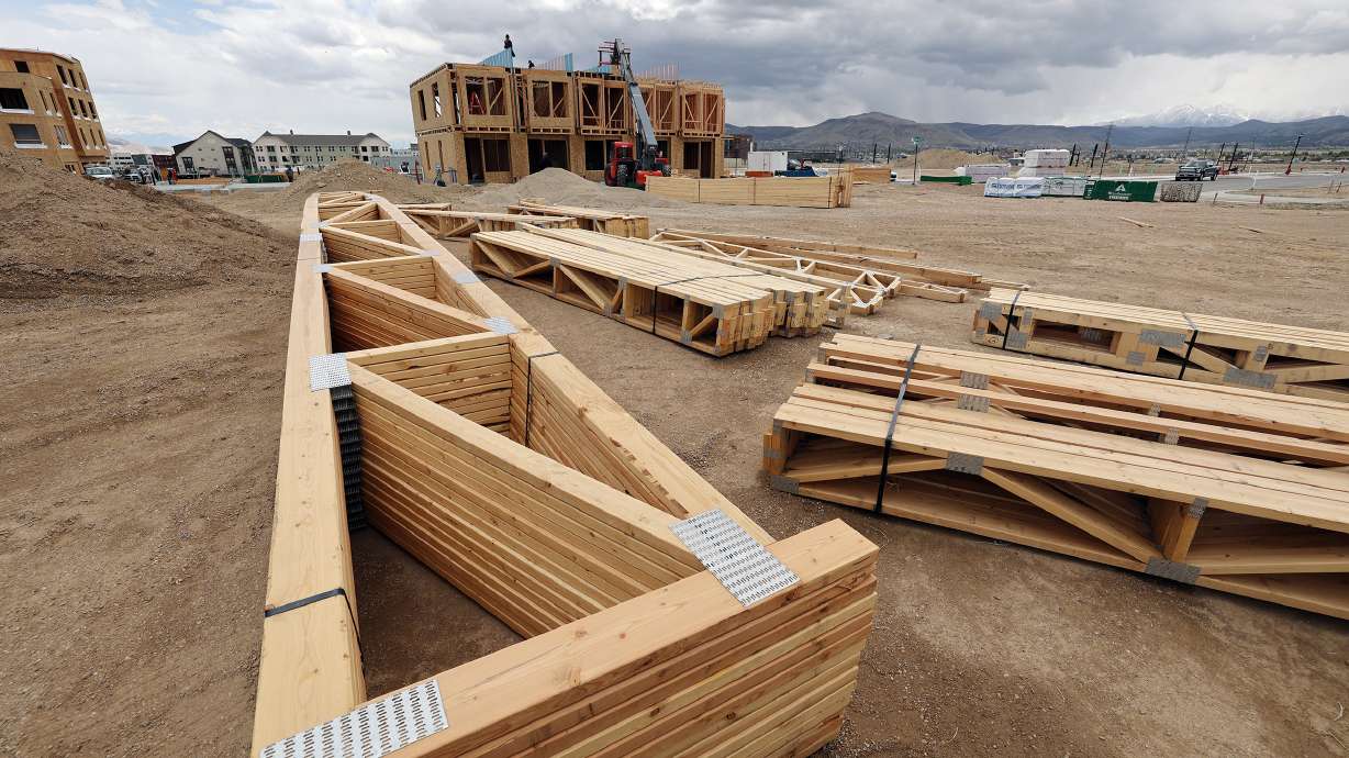 Roof and floor trusses wait to be installed at a building site in South Jordan on May 10. South Jordan was named among the top 10 fastest-rising cities in the nation, according to the 2020 Census. The list includes communities with at least 50,000 residents beginning in 2010.