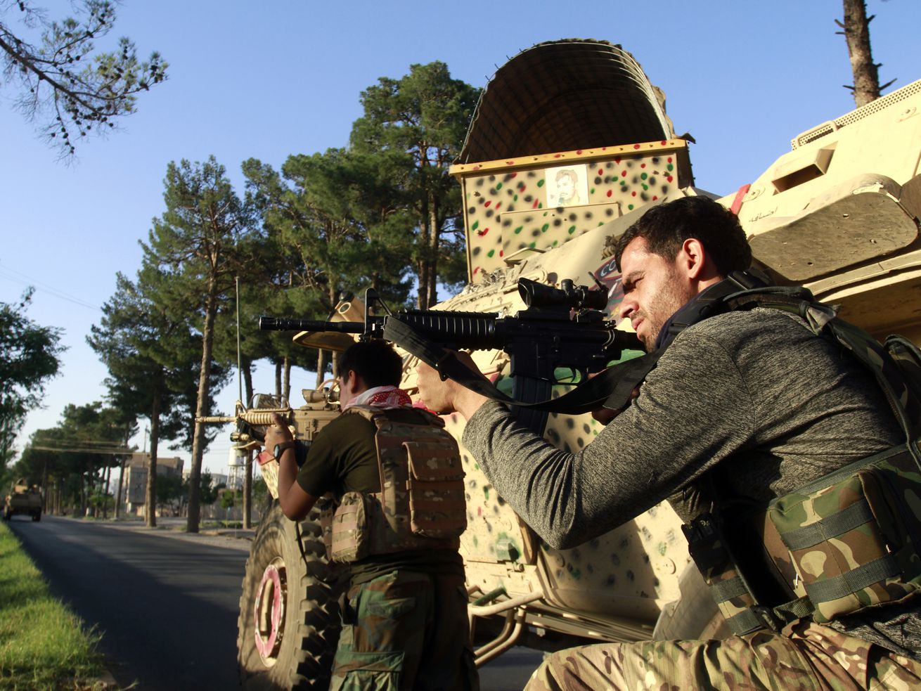 Afghan security personnel take a position during fighting between Taliban and Afghan security forces west of Kabul, Afghanistan, on Aug. 3. Utah Sen. Mitt Romney says the Biden administration is paying "lip service” to its commitment to relocate Afghans who have aided the U.S. during the prolonged war in Afghanistan.