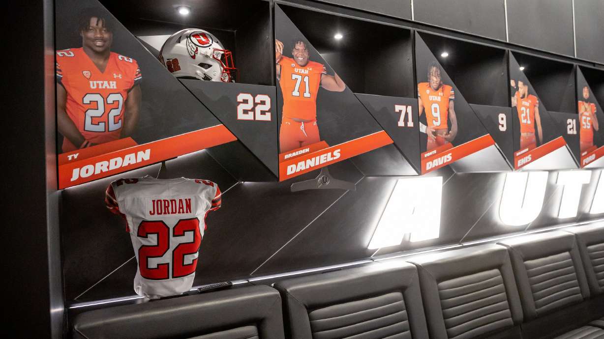 Ty Jordan’s retired jersey is displayed inside the home team locker room in the new Ken Garff Red Zone at Rice-Eccles Stadium in Salt Lake City on Thursday, Aug. 12, 2021.