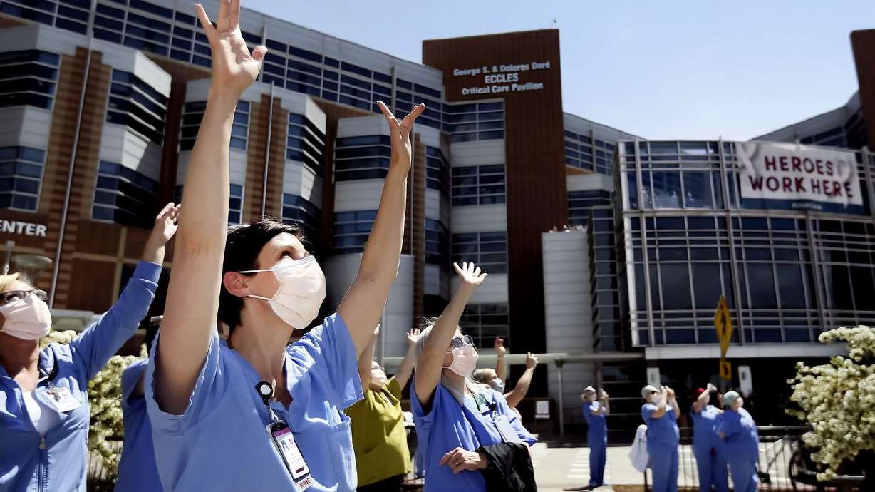 Nikole Ihler waves as Hill Air Force Base’s 388th Fighter Wing fly in formation over the hospital in Salt Lake City on Thursday, April 30, 2020. An April study of nearly 28,000 University of Utah Health system clinical and nonclinical faculty, staff and trainees found that 20% of respondents, 1 in 5, are considering leaving their professions.