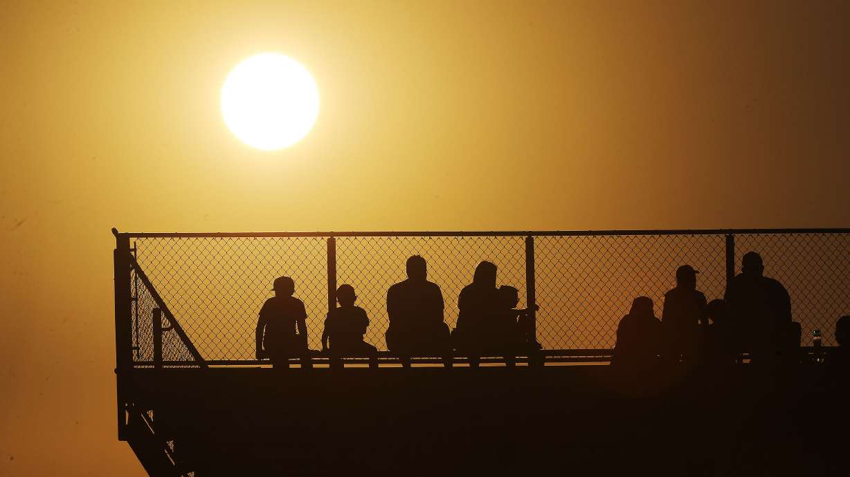 Fans watch Fremont and Skyridge as the sun sets in Lehi on Thursday, Aug. 12, 2021.