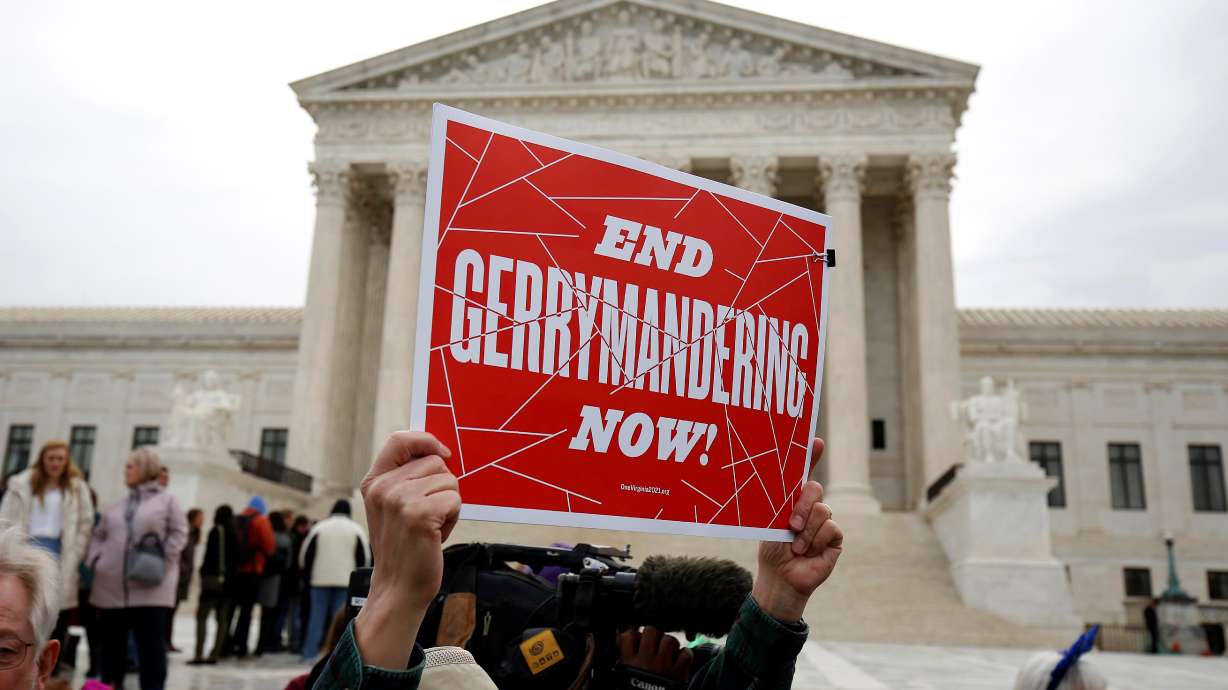 Demonstrators rally in front of the Supreme Court before oral arguments in a redistricting case in Washington, March 28, 2018. The once-a-decade process of redistricting has begun with the release of U.S. census data on Thursday.