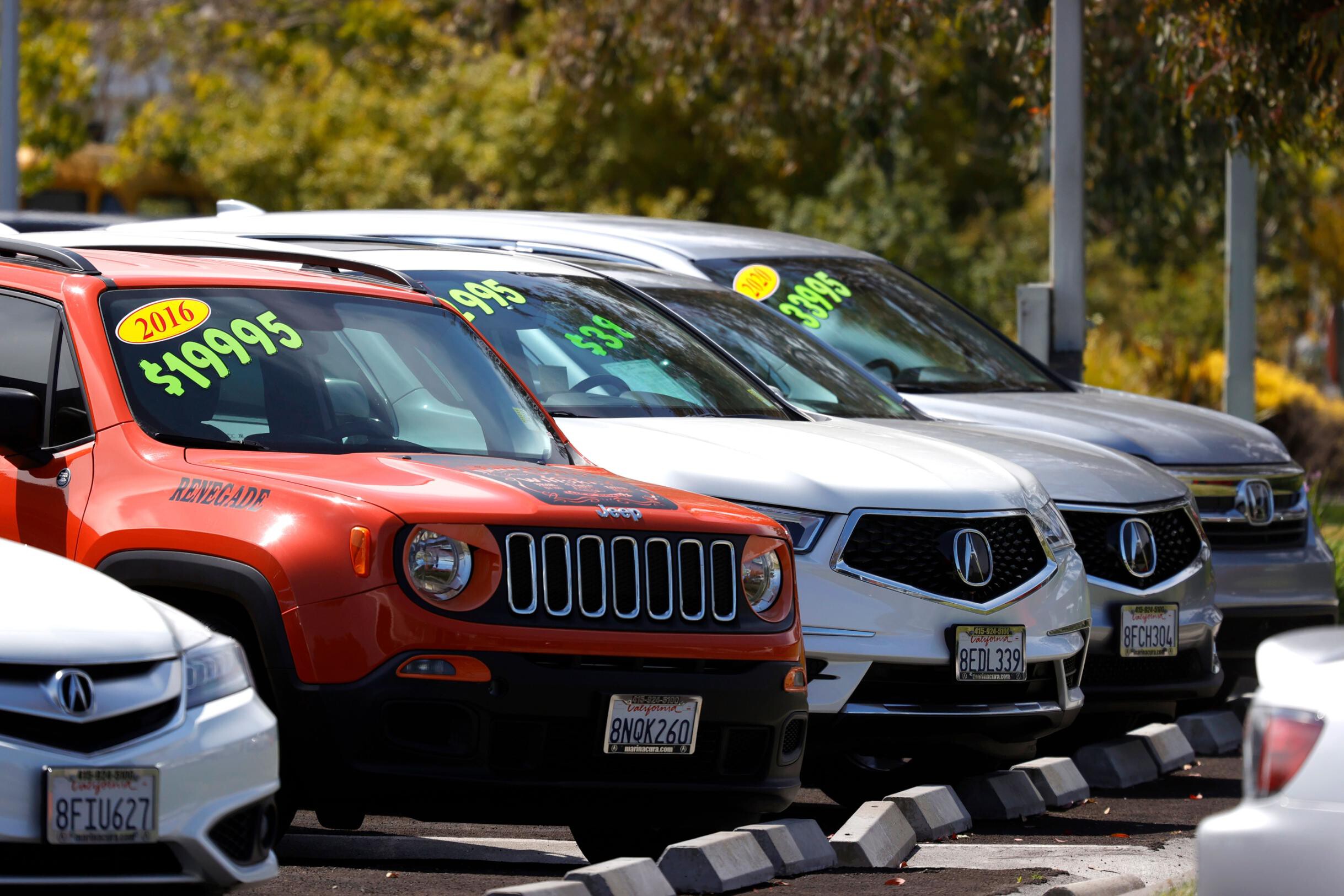 Used cars are displayed on the sales lot at Marin Acura on July 13 in Corte Madera, California.