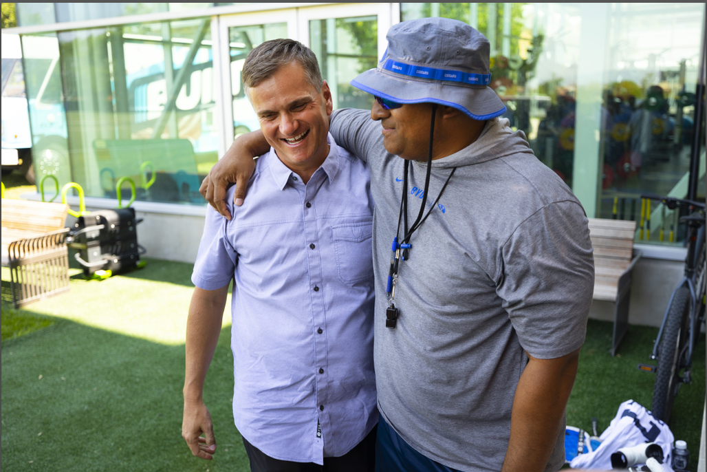 BYU head coach Kalani Sitake and Built Bars co-founder Nick Greer embrace after talking about the Cougars' new partnership with Built Bars, LLC, Friday, Aug. 13, 2021 in Provo.