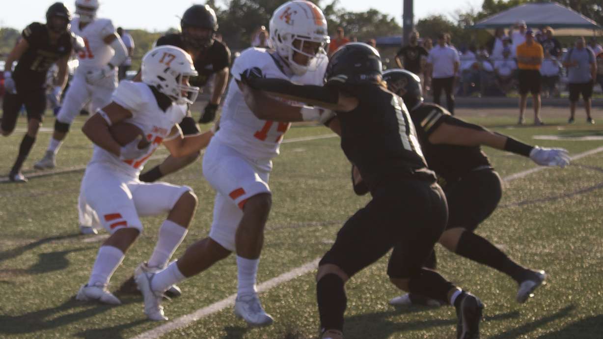 Timpview's Pokaiaua Haunga runs behind a blocker against Lone Peak during the Knights' 44-31 win over Timpview, Friday, Aug. 13, 2021 in Highland. Haunga, a BYU commit, is the No. 11-rated recruit in Utah by 247Sports in the Class of 2023.