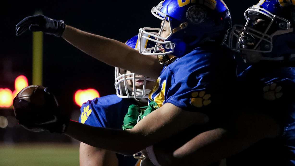 Oremâ's Kolton Brown celebrates after scoring a touchdown in the 5A football state championship game against Timpview at Cedar Valley High in Eagle Mountain on Friday, Nov. 20, 2020.