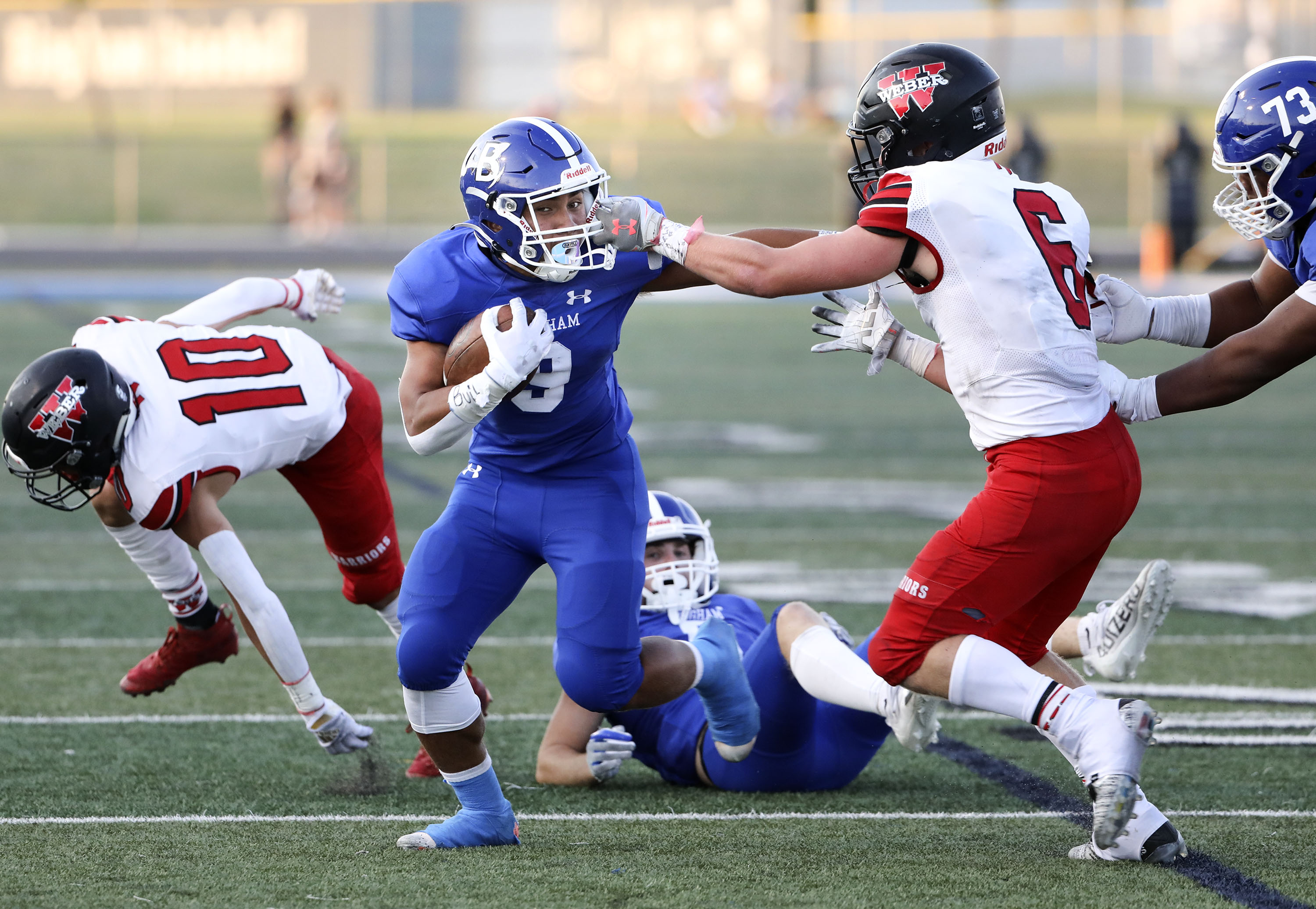 Bingham's Havea Foto rushes past Weber's Crash Coggins to score at Bingham High in South Jordan on Friday, Aug. 13, 2021.
