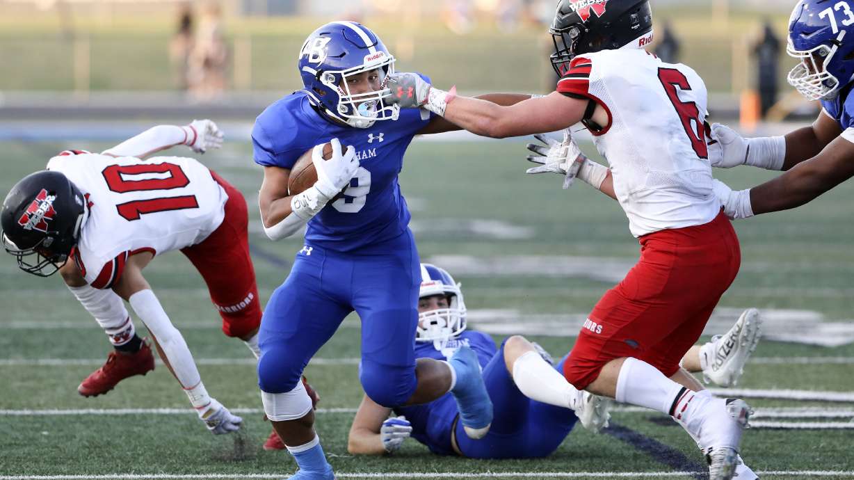 Bingham's Havea Foto rushes past Weber's Crash Coggins to score at Bingham High in South Jordan on Friday, Aug. 13, 2021.