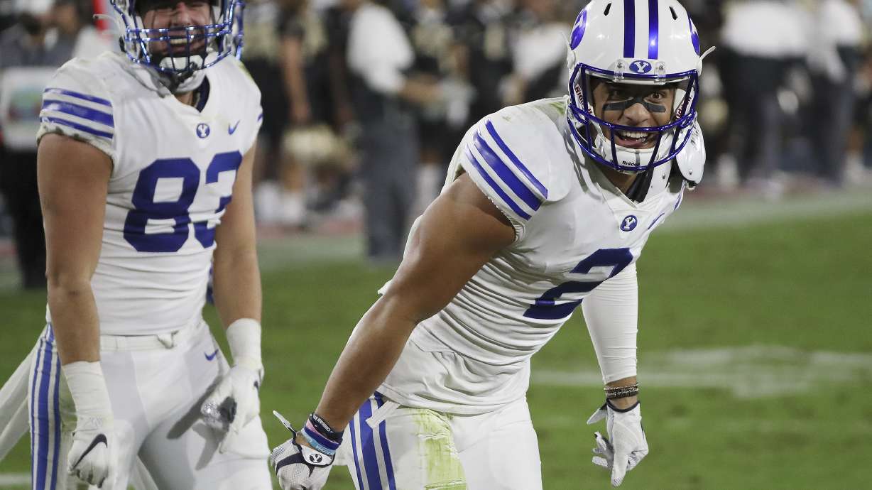 BYU wide receiver Neil Pau'u (2) celebrates his touchdown against the UCF Knights with BYU tight end Isaac Rex during the Boca Raton Bowl in Boca Raton, Fla., on Dec. 22, 2020.