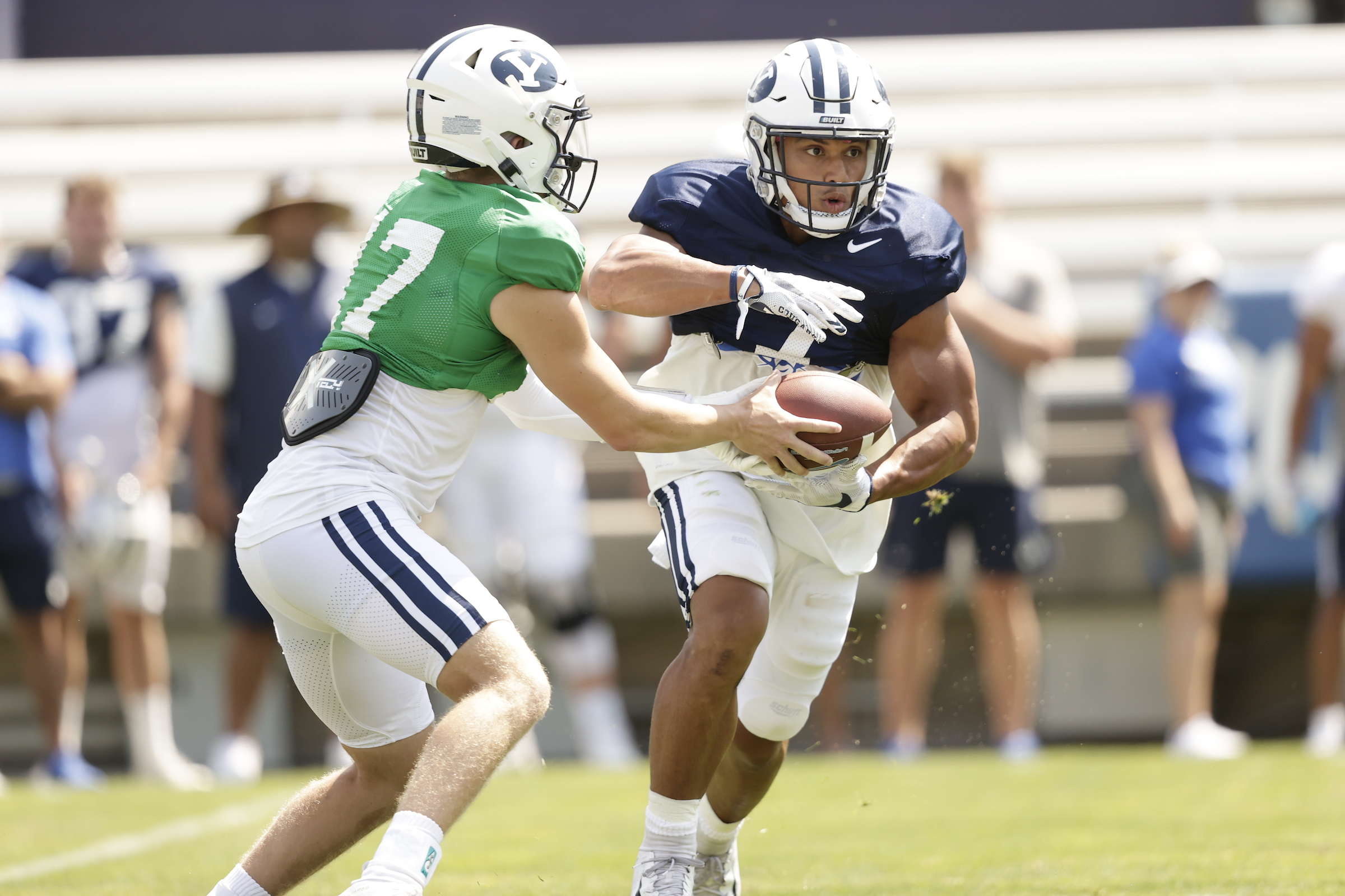 BYU running back Hinckley Ropati takes a handoff from quarterback Jacob Conover during a scrimmage Saturday, Aug. 14, 2021 at LaVell Edwards Stadium.