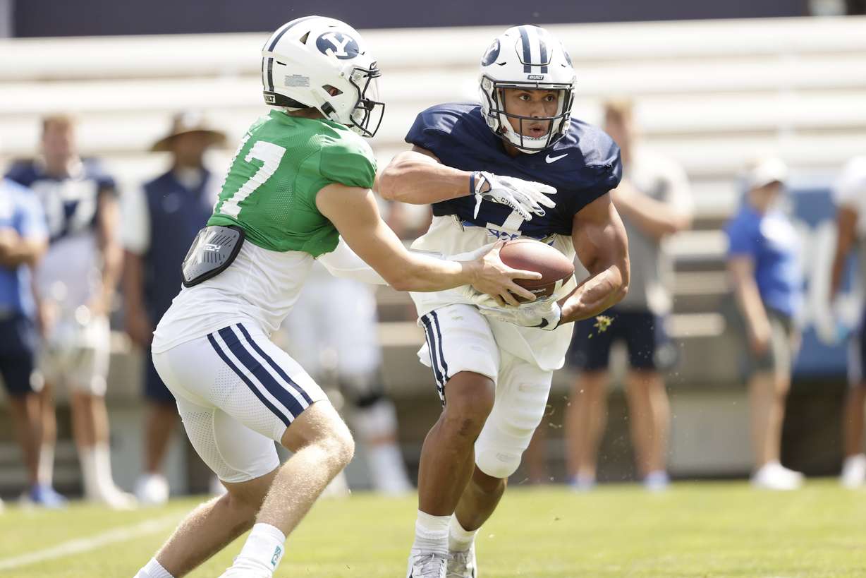 BYU running back Hinckley Ropati takes a handoff from quarterback Jacob Conover during a scrimmage Saturday, Aug. 14, 2021 at LaVell Edwards Stadium.